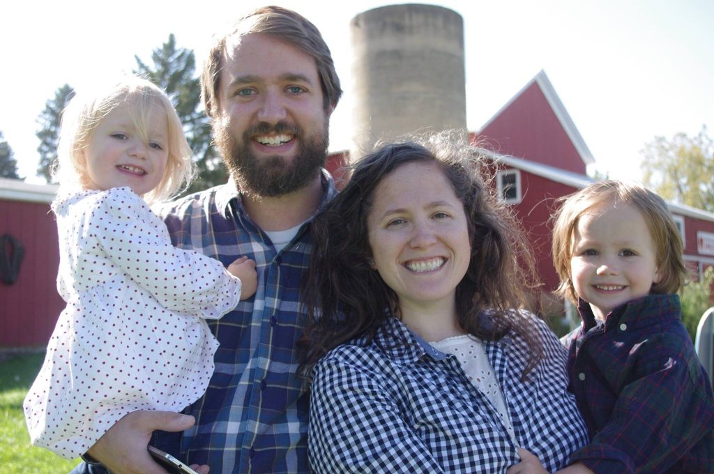 Family photo while apple picking in 2016